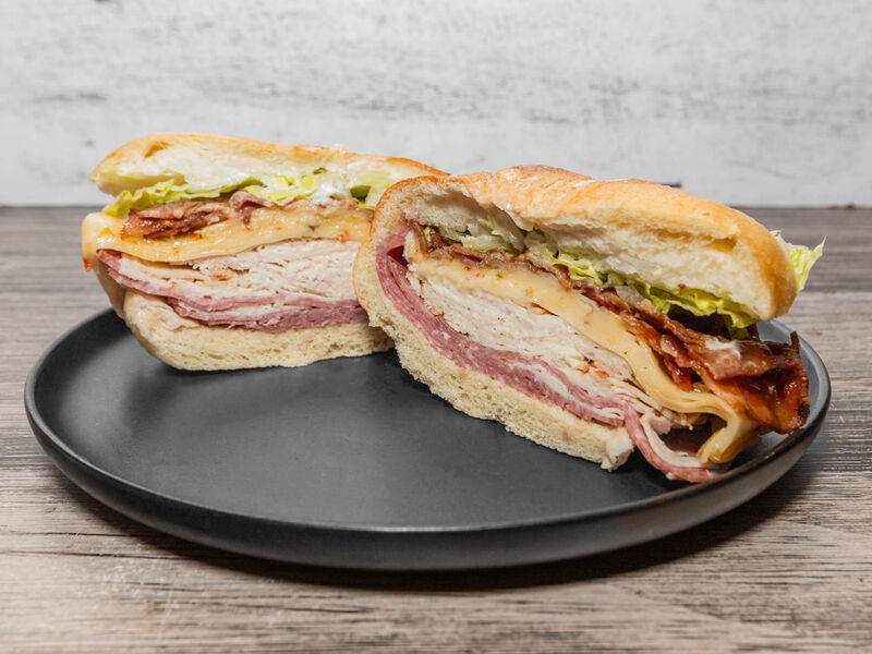 Don't Tell Jim sandwich: turkey, salami, bacon and pepper jack with lettuce on a roll